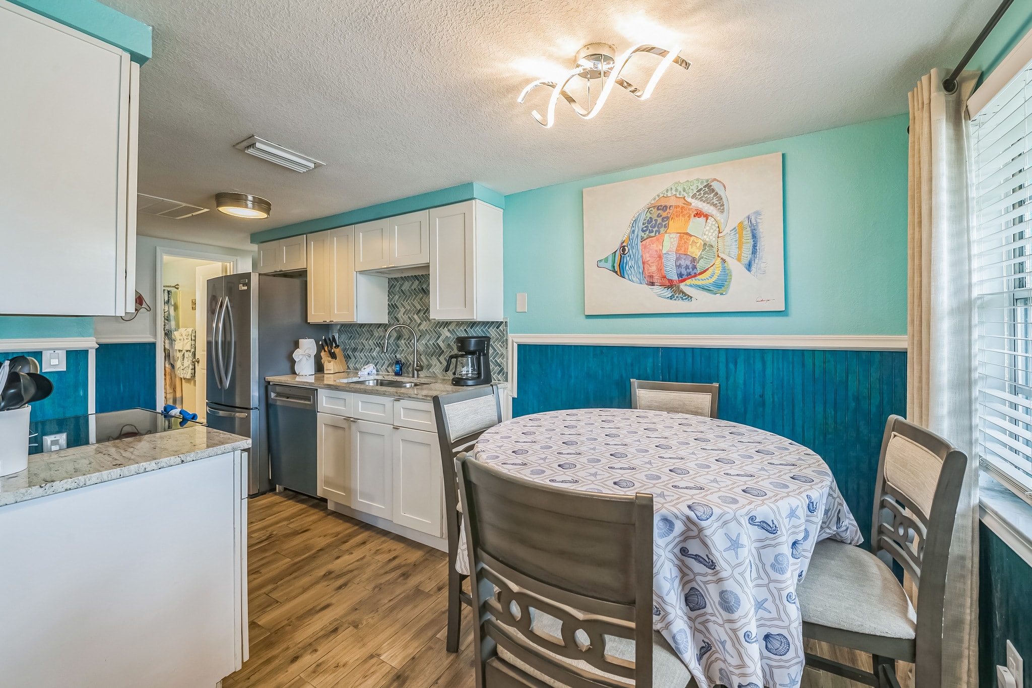Dining room with colorful artwork